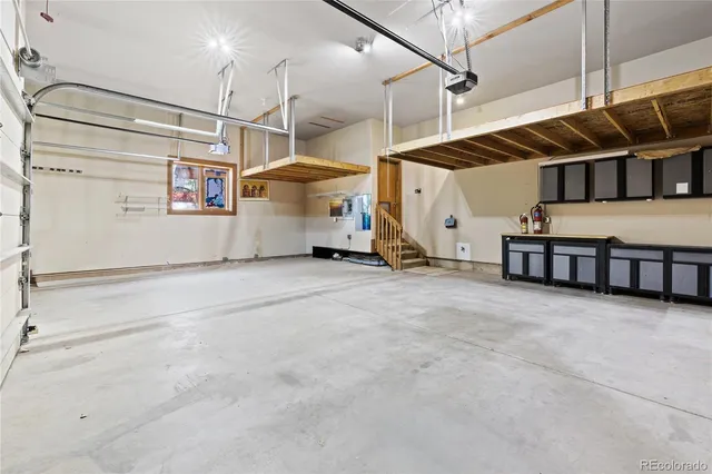 a view of a garage with stairs