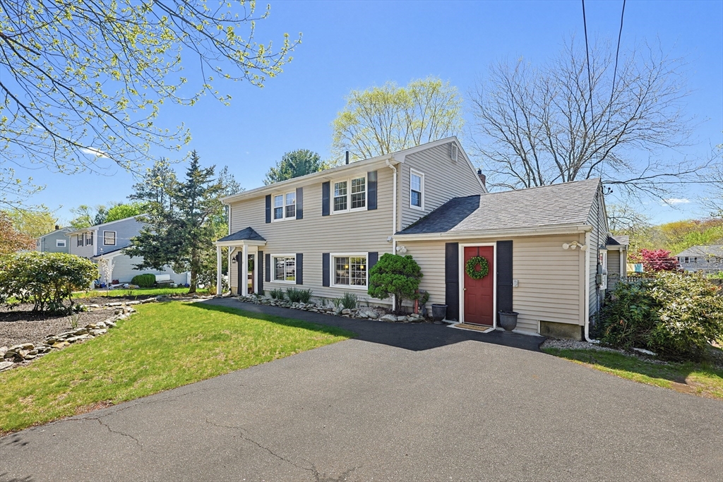 18 Anchorage Road Franklin, MA 02038 - Photo 2 of 42 a front view of a house with a yard and garage