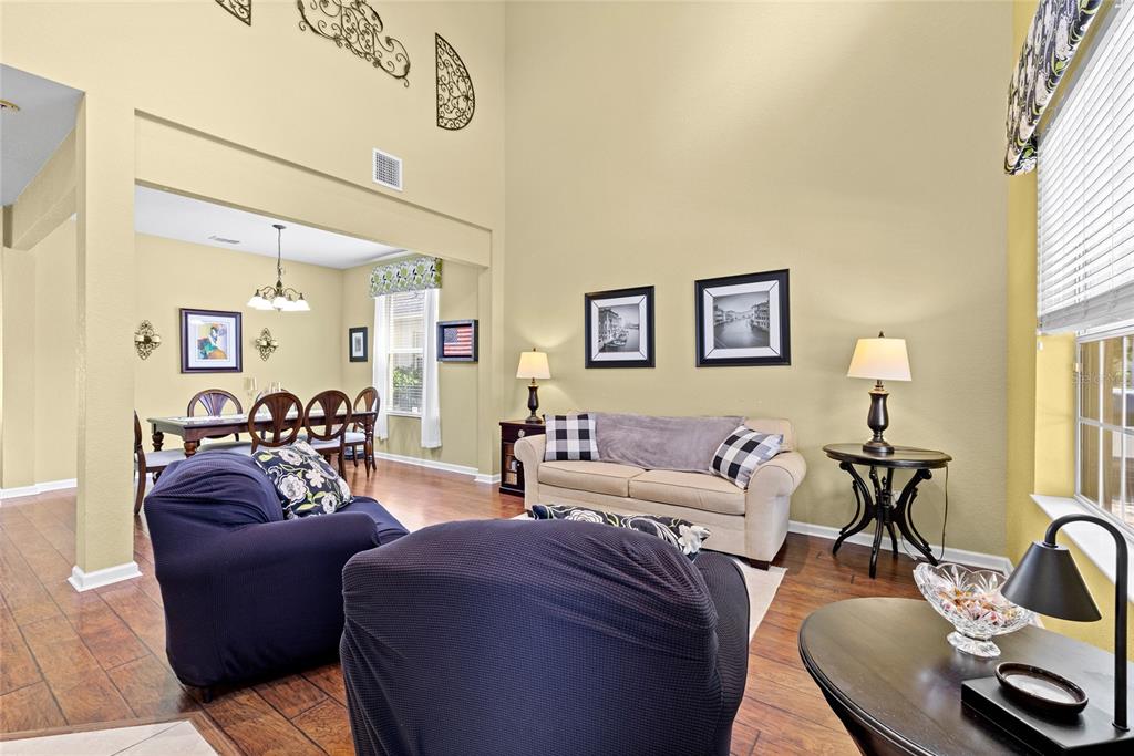 13243 Charfield Street Windermere, FL 34786 - Photo 14 of 39 a living room with furniture and a wooden floor