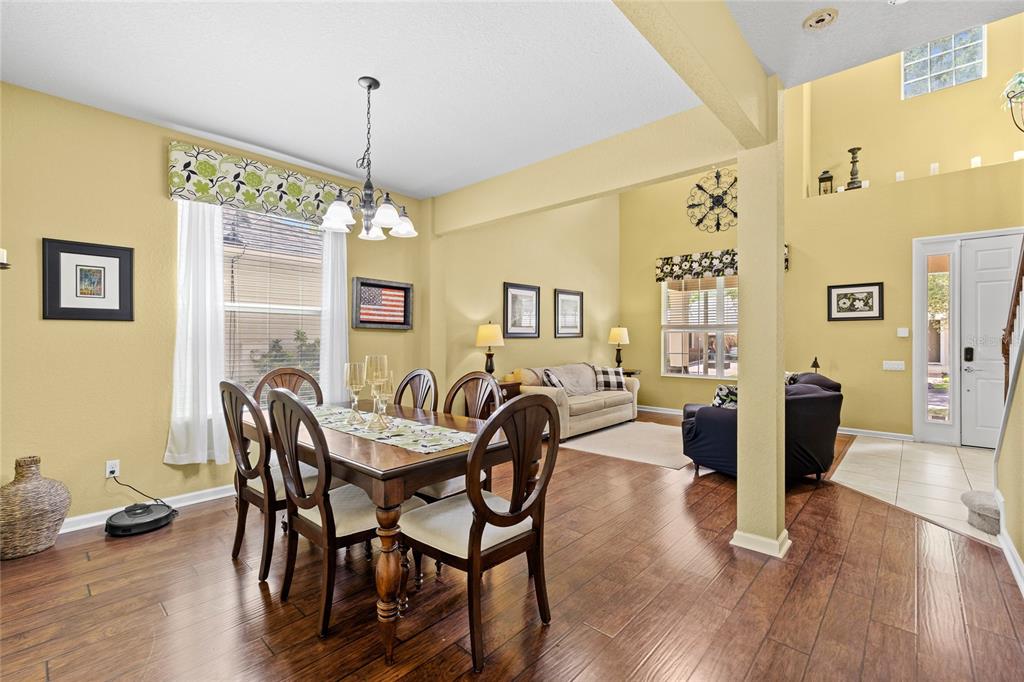 13243 Charfield Street Windermere, FL 34786 - Photo 15 of 39 a view of a dining room with furniture window and wooden floor