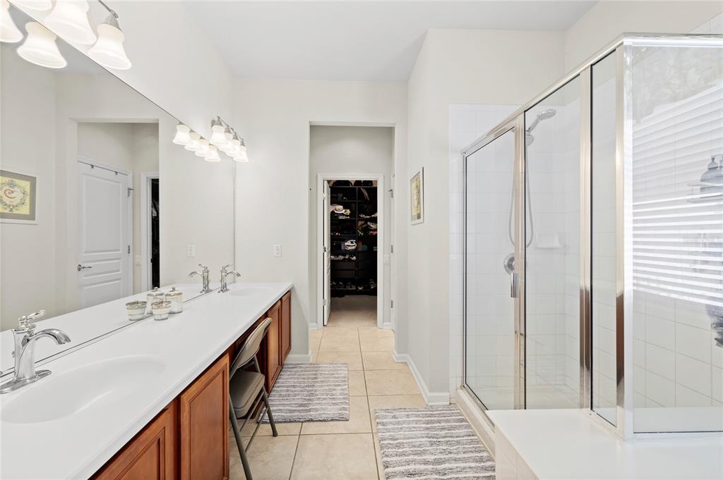 13243 Charfield Street Windermere, FL 34786 - Photo 24 of 39 a en suite bathroom with a double vanity sink and a mirror