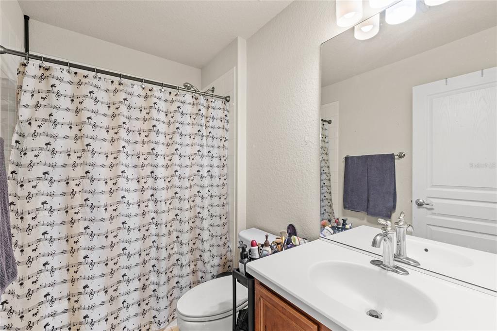 13243 Charfield Street Windermere, FL 34786 - Photo 29 of 39 a bathroom with a sink toilet and shower