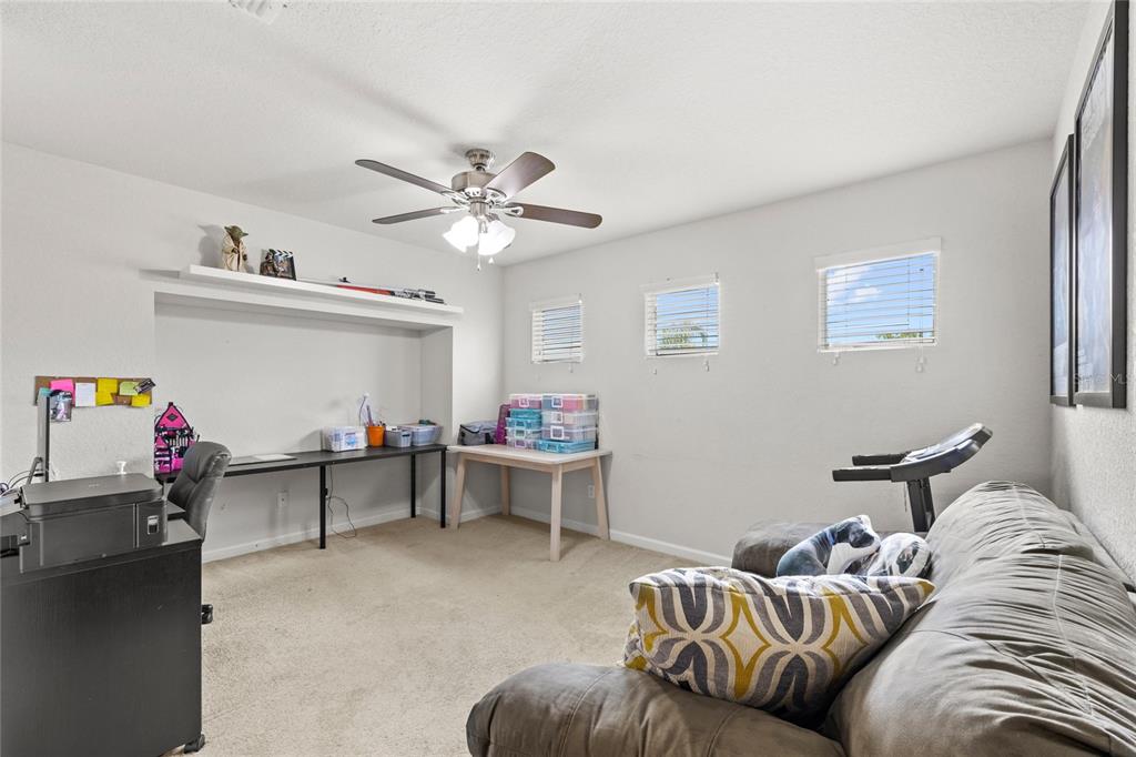 13243 Charfield Street Windermere, FL 34786 - Photo 32 of 39 a living room with furniture and a couch
