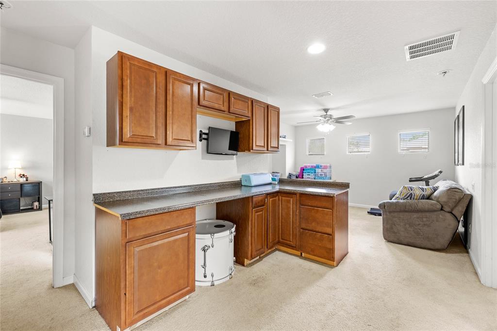 13243 Charfield Street Windermere, FL 34786 - Photo 33 of 39 a kitchen with cabinets and window
