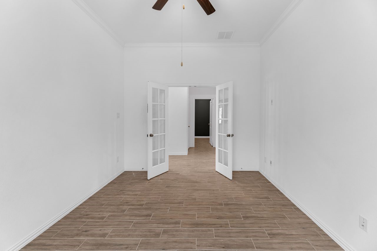 21714 Grayson Highlands Way Porter, TX 77365 - Photo 12 of 27 a view of a livingroom with wooden floor