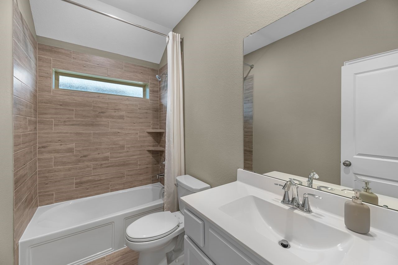 21714 Grayson Highlands Way Porter, TX 77365 - Photo 20 of 27 a bathroom with a sink toilet and shower