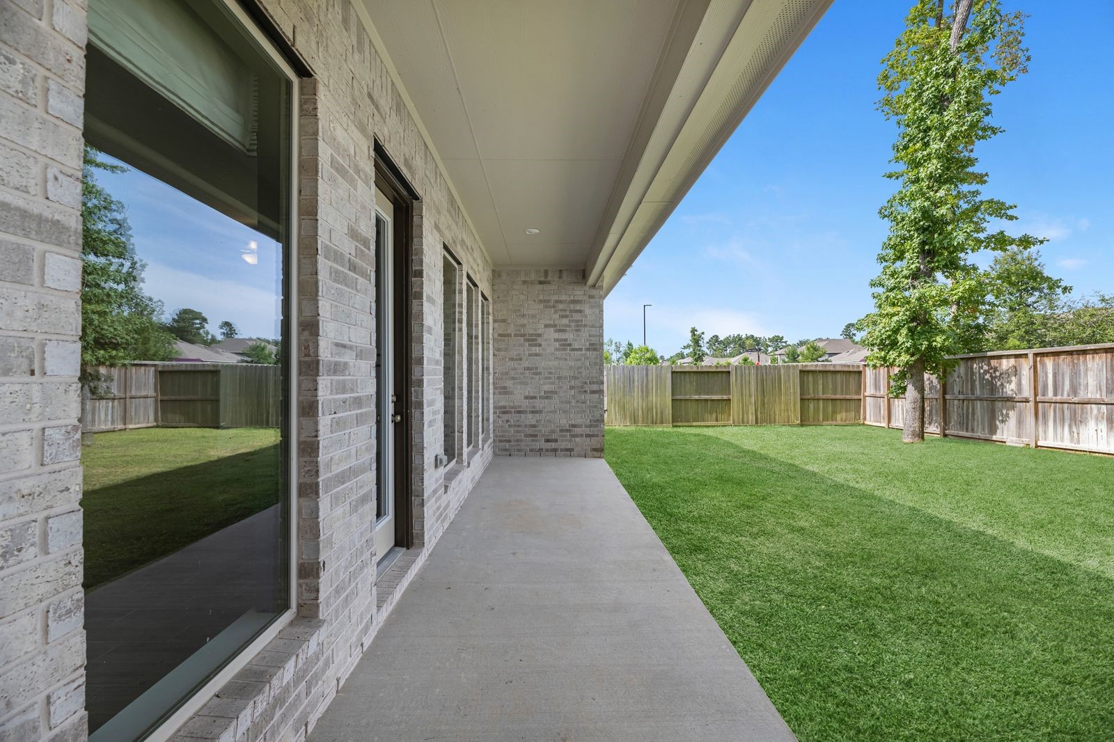 21714 Grayson Highlands Way Porter, TX 77365 - Photo 26 of 27 a view of a house with a yard