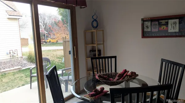 a view of a dining room with furniture window and outside view