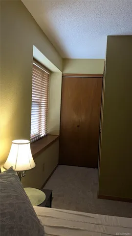 a view of a room with a table and chairs