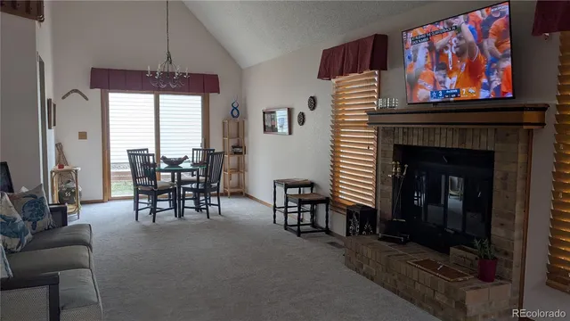 a dining room with furniture and window