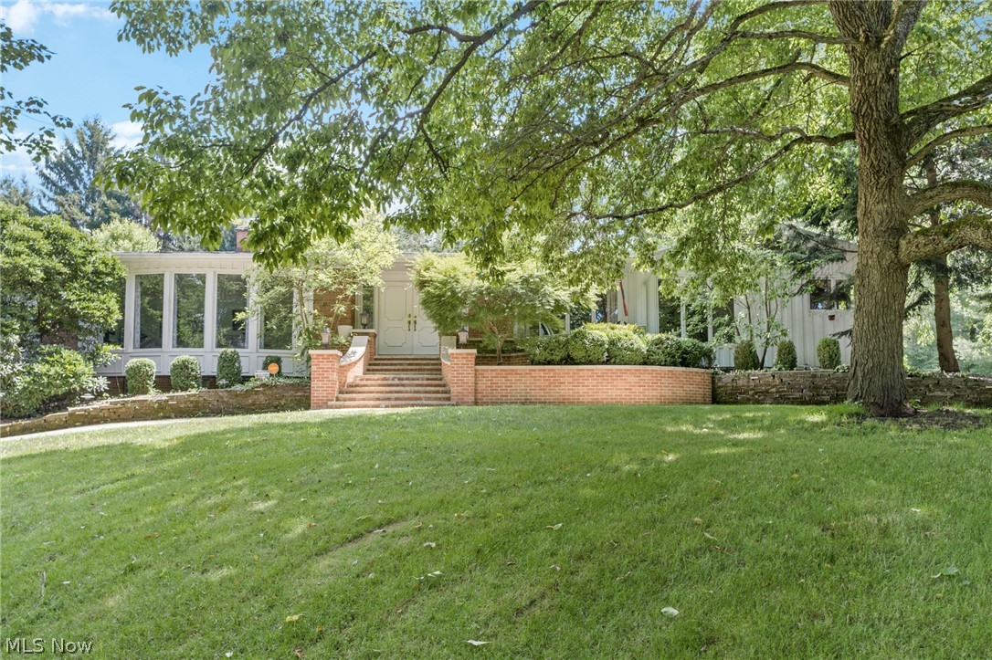 Sprawling ranch with 5 bedrooms, 3 full and 2 half baths nestled on over an acre of land in Bath township.