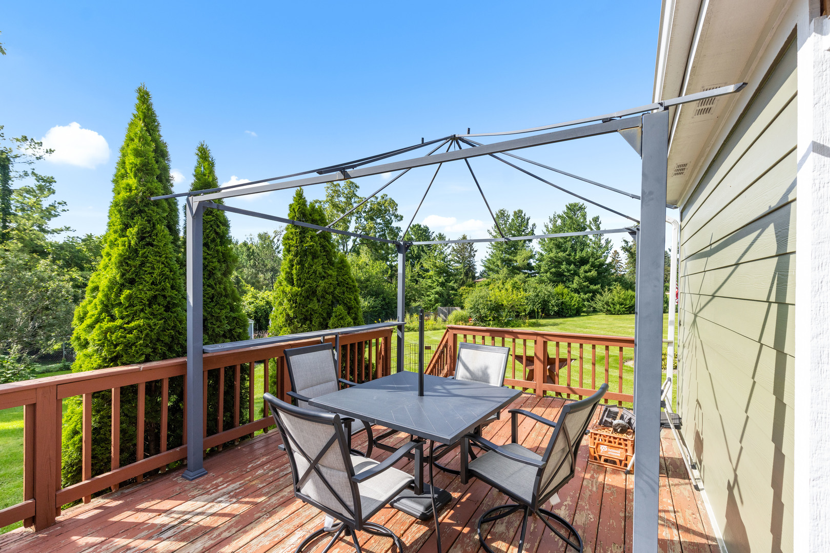 2019 Hawthorn Road Marengo, IL 60152 - Photo 19 of 24 a view of a balcony with furniture and umbrella