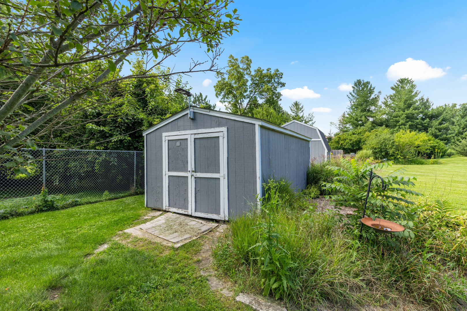 2019 Hawthorn Road Marengo, IL 60152 - Photo 21 of 24 a house with trees in the background