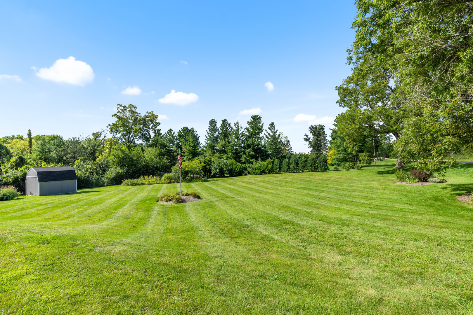 2019 Hawthorn Road Marengo, IL 60152 - Photo 24 of 24 a swimming pool with trees in the background
