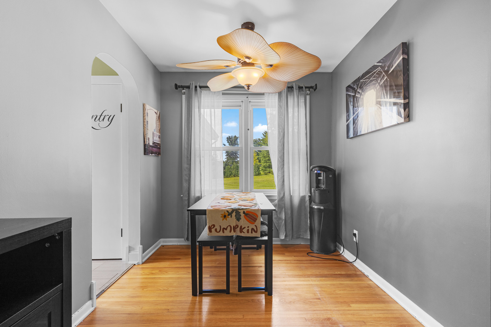2019 Hawthorn Road Marengo, IL 60152 - Photo 5 of 24 a view of a livingroom with wooden floor and a ceiling fan