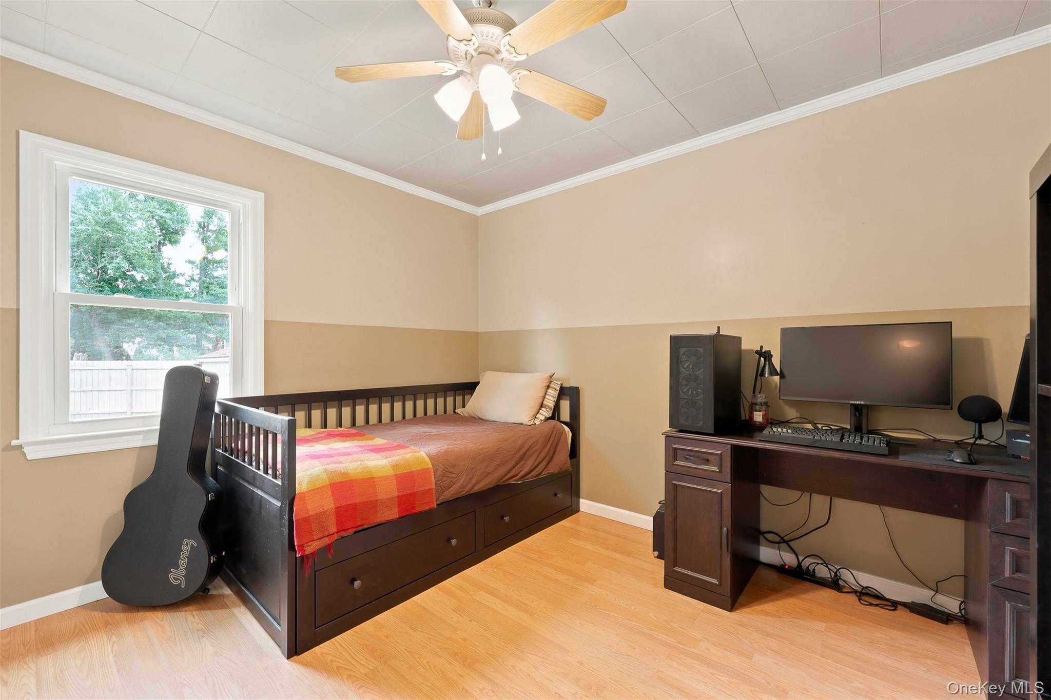 48 Ryerson Road New Hampton, NY 10958 - Photo 14 of 33 Bedroom featuring wood-finish flooring, a contemporary ceiling fan, and a single window with white trim