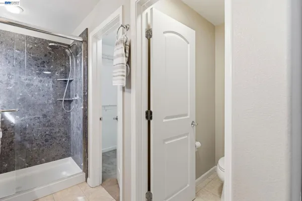 a bathroom with a glass shower door