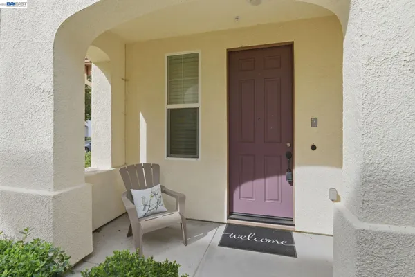 a bench sitting in front of a door