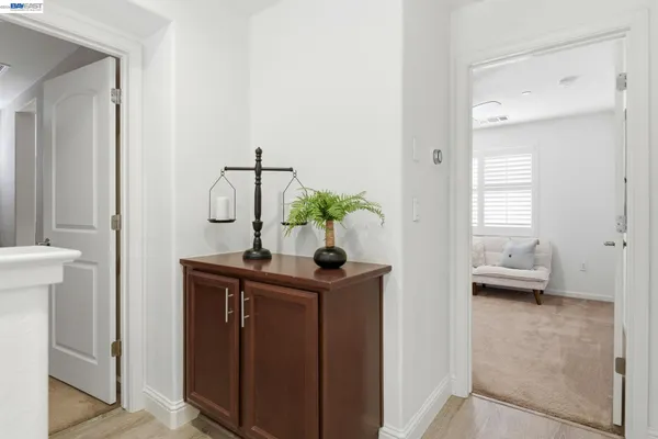 a view of bathroom with a sink and mirror