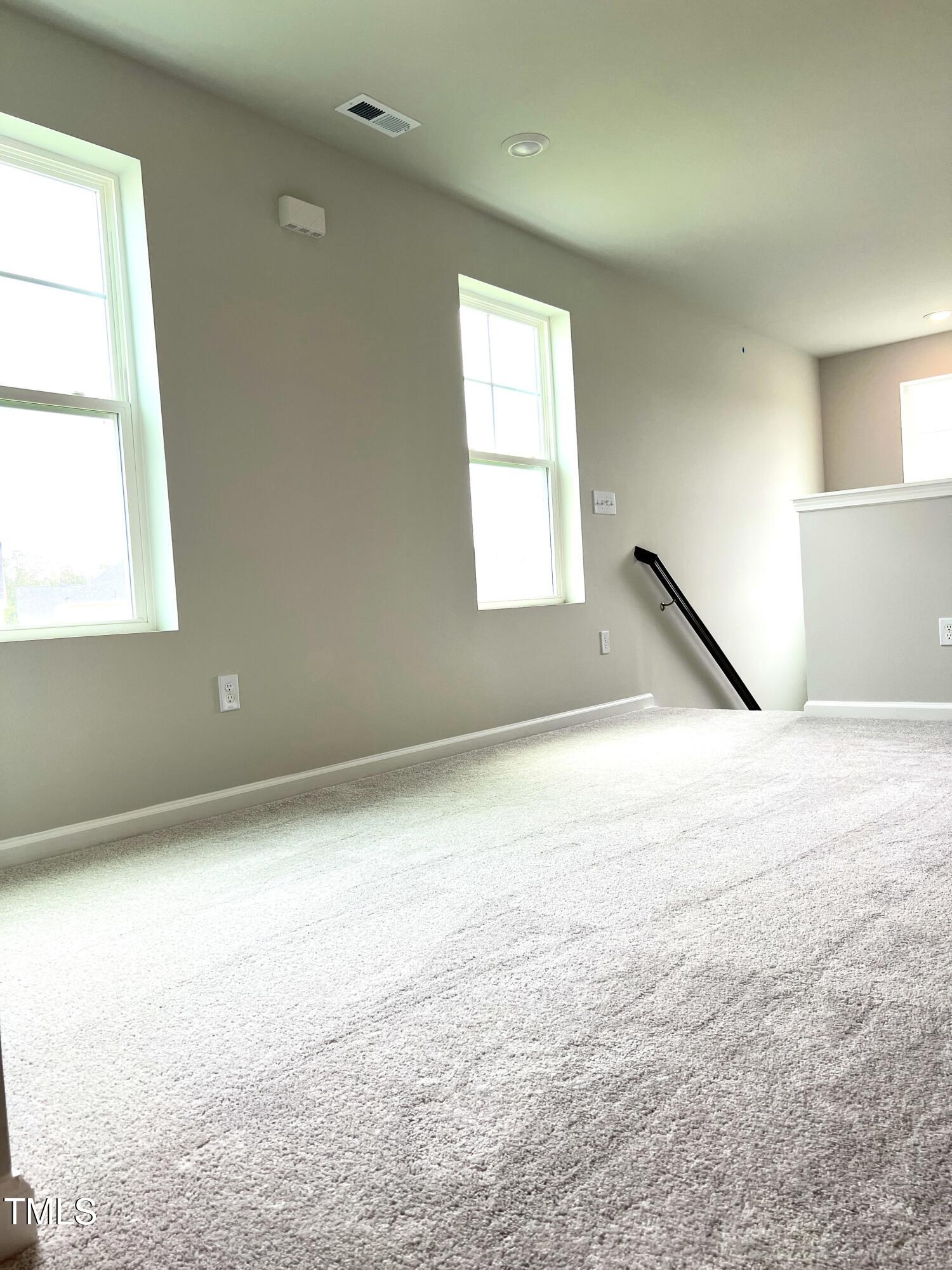 429 Lily Grv Loop Raleigh, NC 27610 - Photo 18 of 32 an empty room with a window