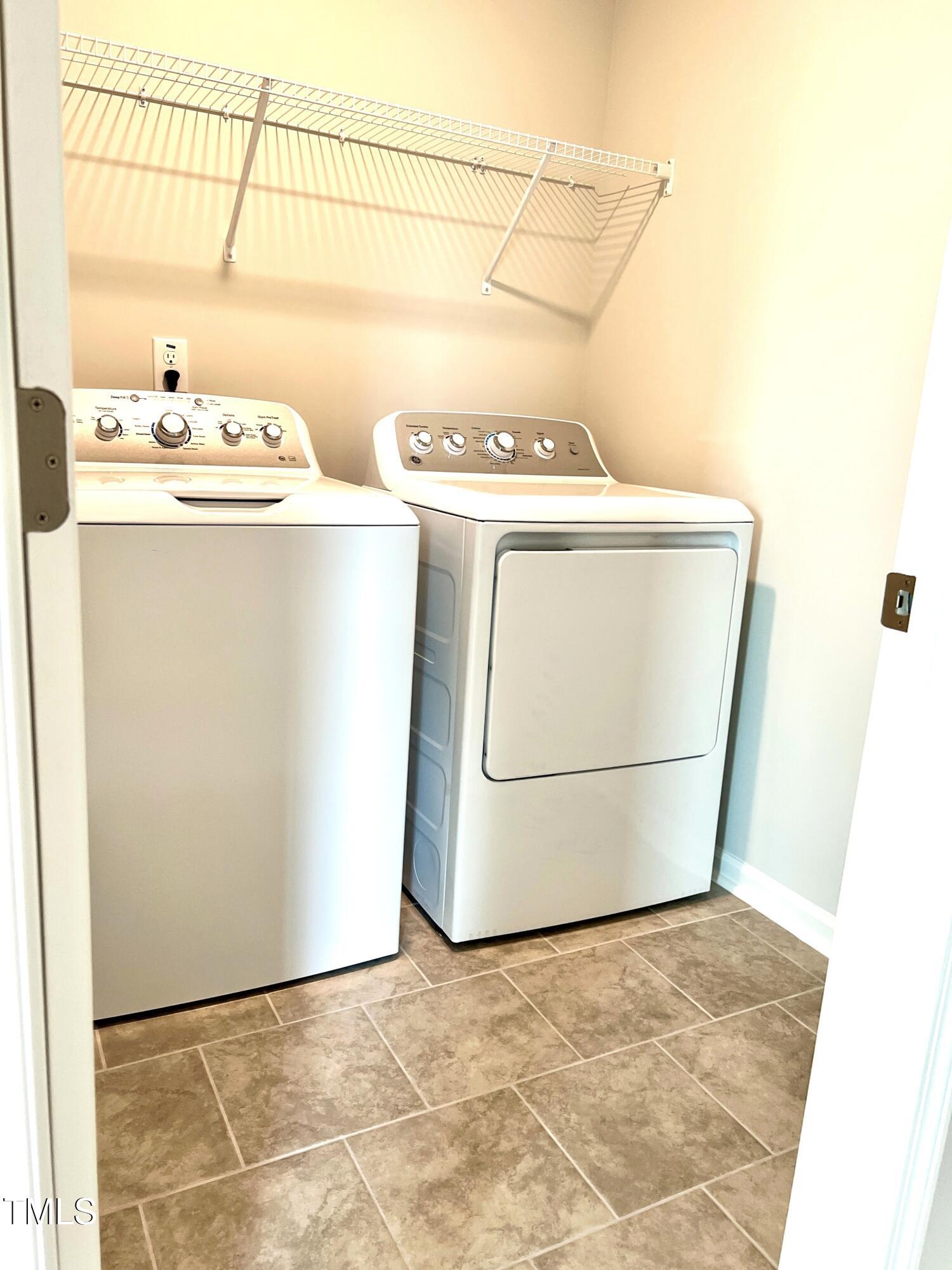 429 Lily Grv Loop Raleigh, NC 27610 - Photo 20 of 32 a utility room with dryer and washer