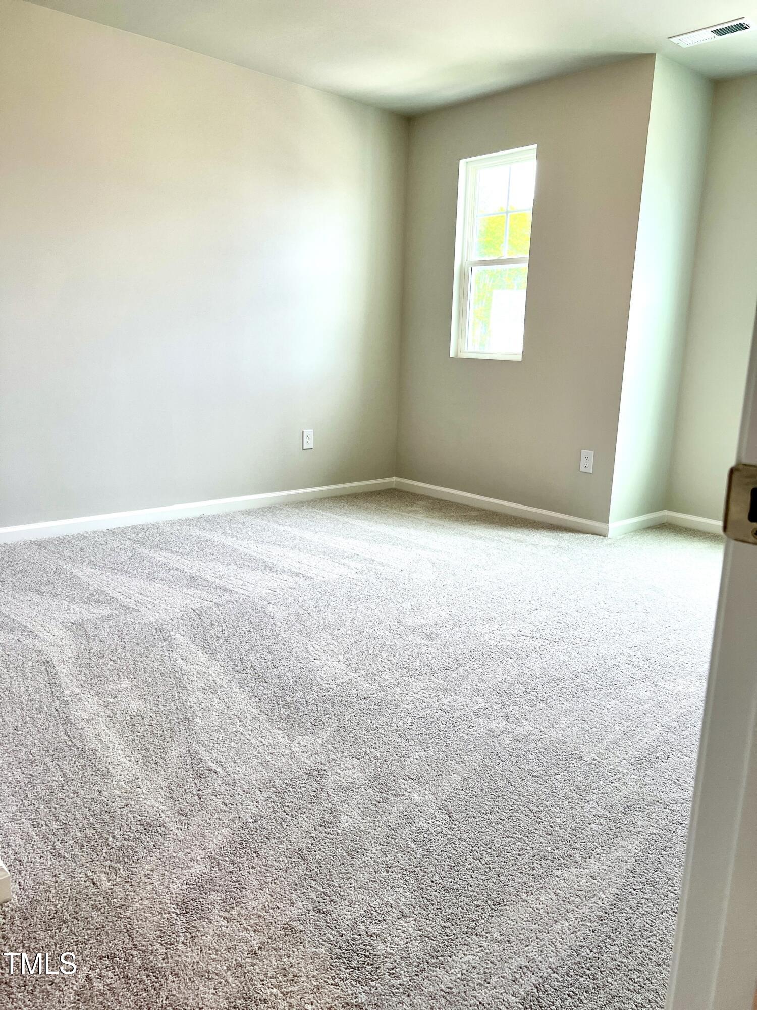 429 Lily Grv Loop Raleigh, NC 27610 - Photo 22 of 32 an empty room with a window