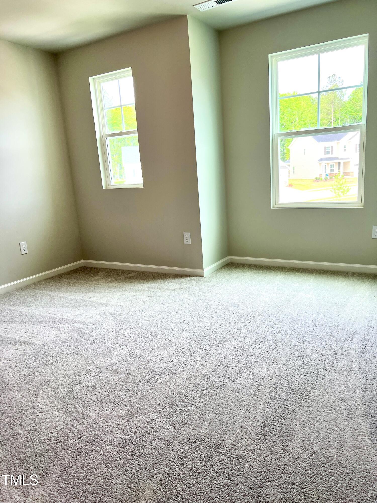 429 Lily Grv Loop Raleigh, NC 27610 - Photo 23 of 32 an empty room with a window