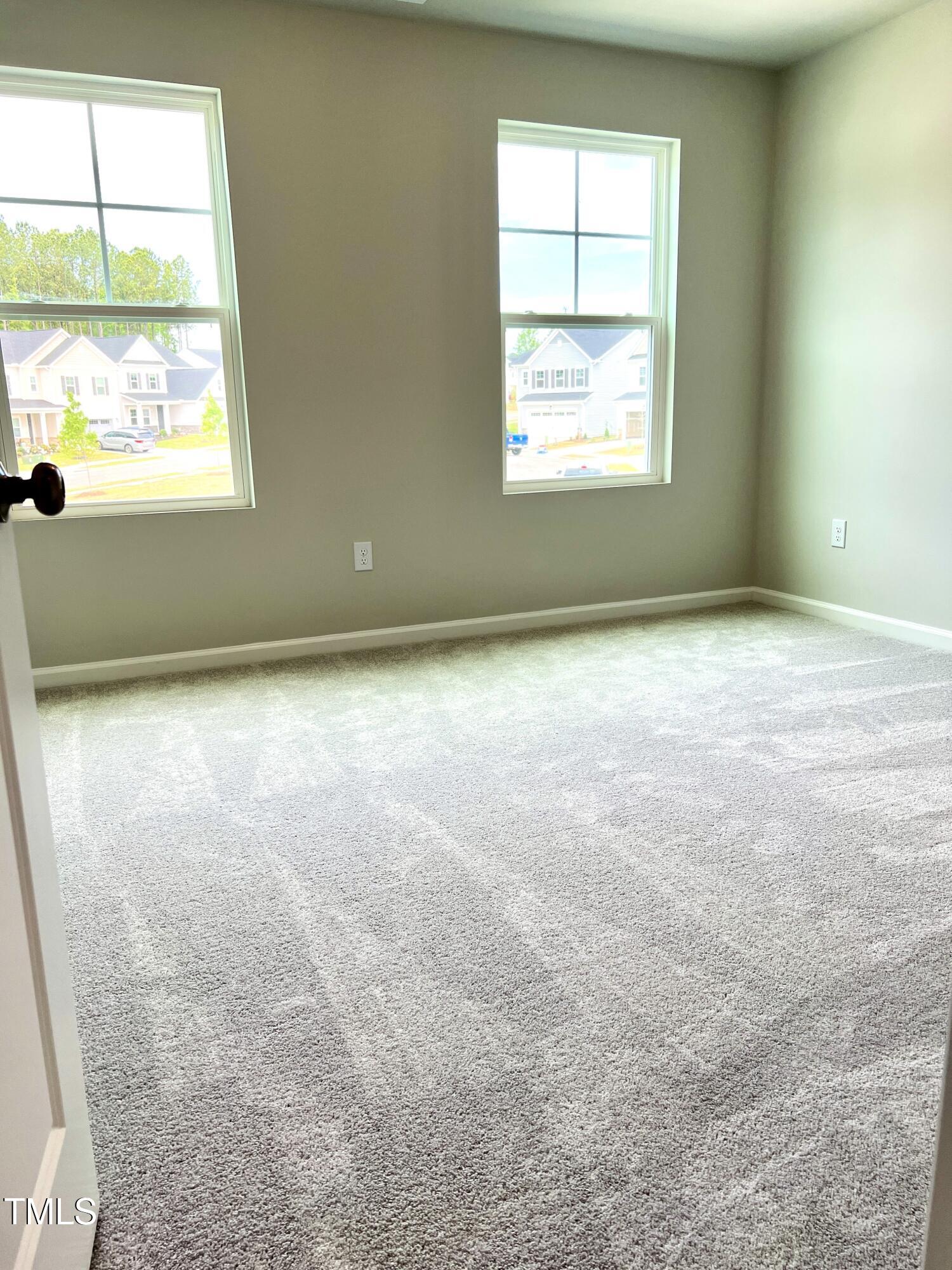 429 Lily Grv Loop Raleigh, NC 27610 - Photo 24 of 32 an empty room with a window
