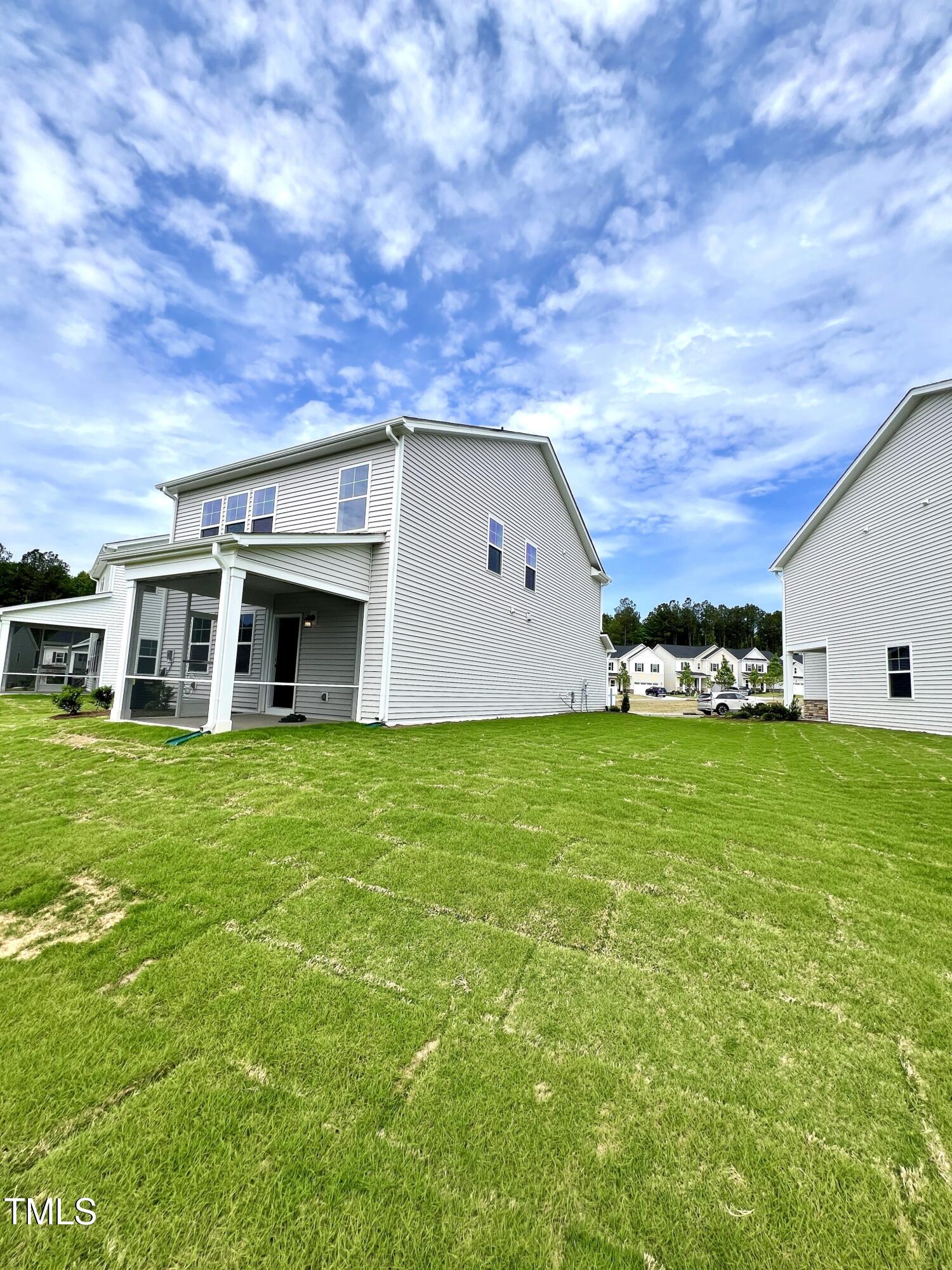 429 Lily Grv Loop Raleigh, NC 27610 - Photo 30 of 32 a view of a house with a yard