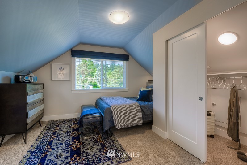 22263 9th Drive Southeast, Unit 9S Bothell, WA 98021 - Photo 22 of 25 a bedroom with a bed and a window