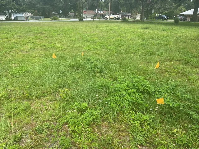 a view of yard with swimming pool and outdoor seating