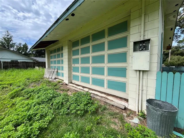 a house view with a backyard space