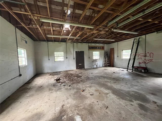 a view of a room with wooden walls
