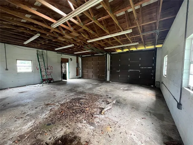 a view of an empty room and a window