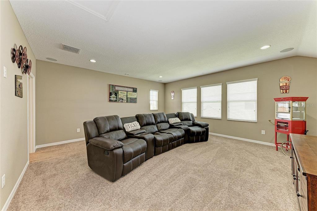 7926 111th Terrace East Parrish, FL 34219 - Photo 35 of 68 a living room with furniture and a flat screen tv