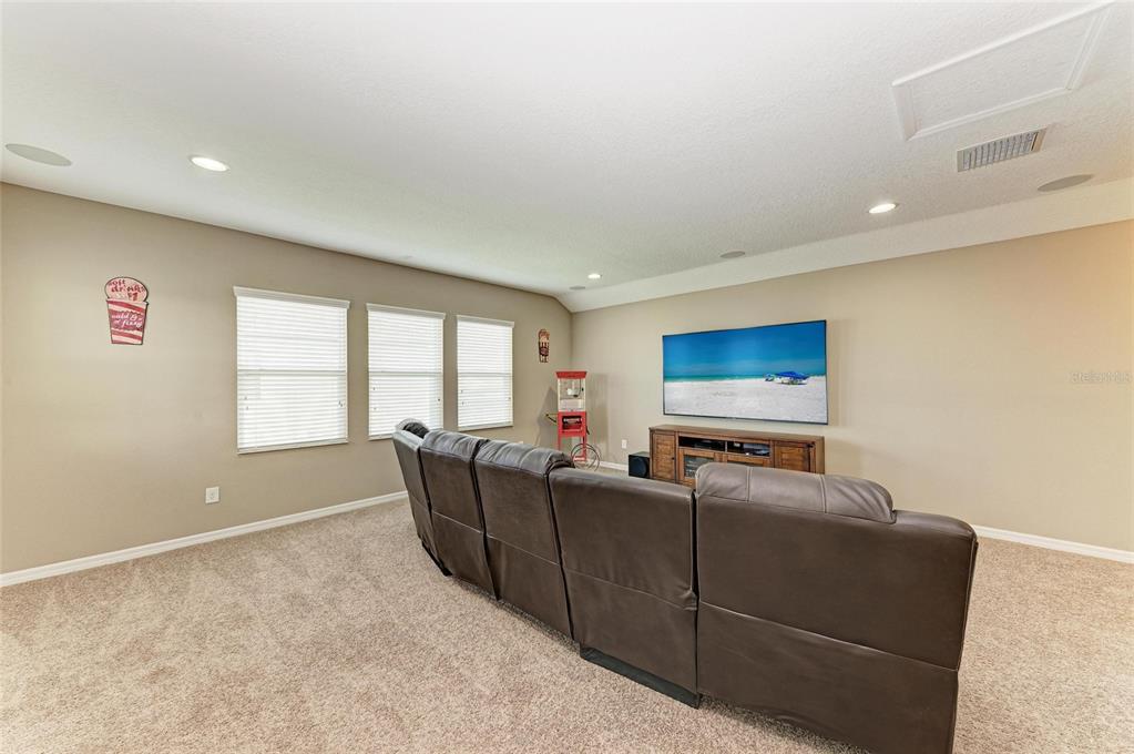 7926 111th Terrace East Parrish, FL 34219 - Photo 36 of 68 a living room with furniture and a flat screen tv