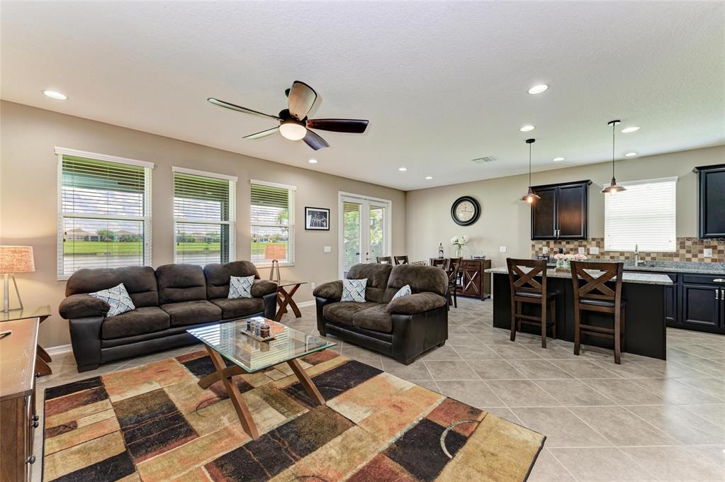 7926 111th Terrace East Parrish, FL 34219 - Photo 9 of 68 a living room with furniture kitchen and a window