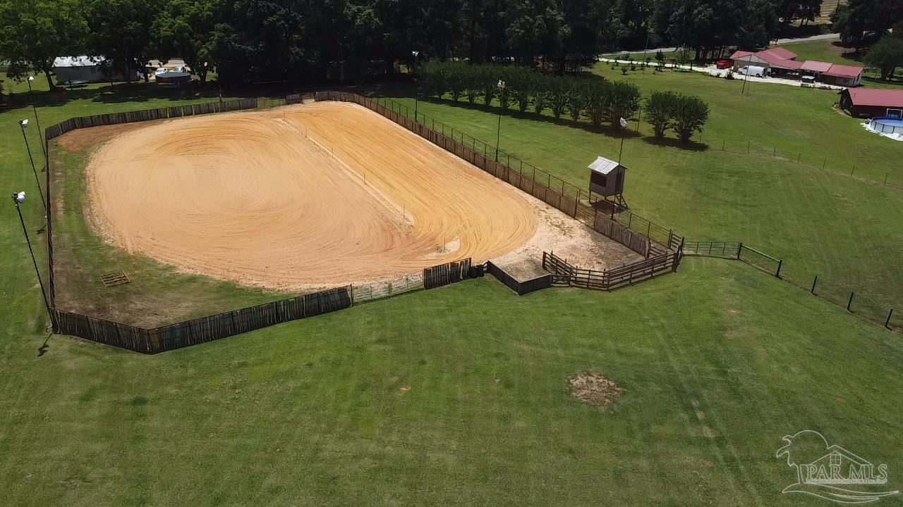 145 Tower Road Uriah, AL 36480 - Photo 58 of 72 a view of a swimming pool with a yard and outdoor seating