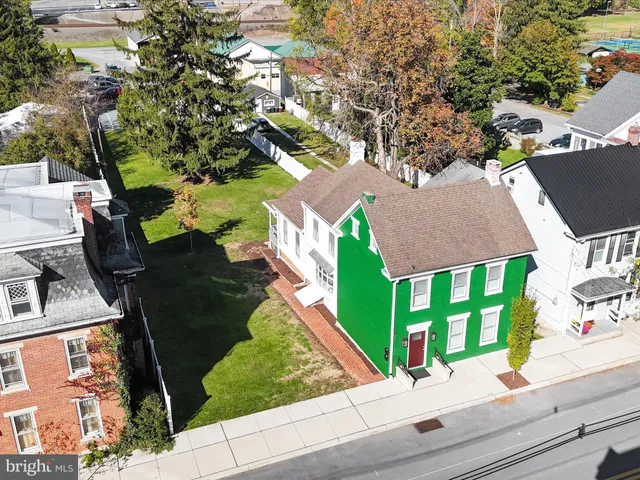 a view of entryway with wooden floor and stairs