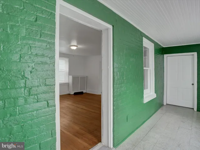 a kitchen with a sink and a refrigerator