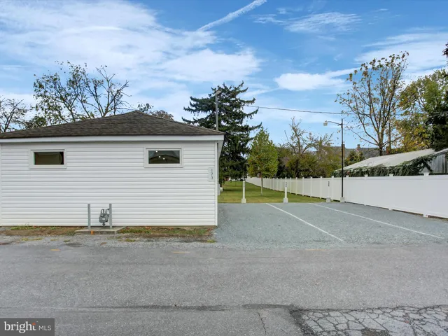 a view of a park with large trees