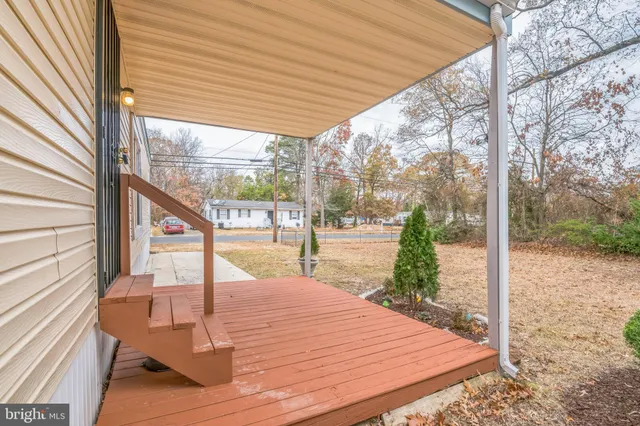 a view of a balcony with wooden floor