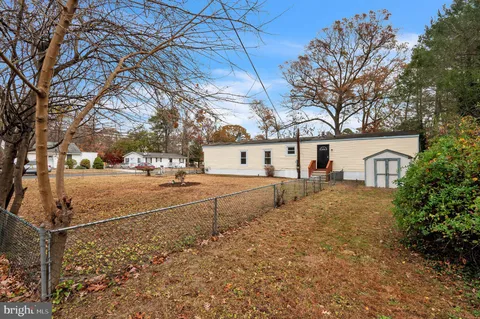 a view of a yard with brick house