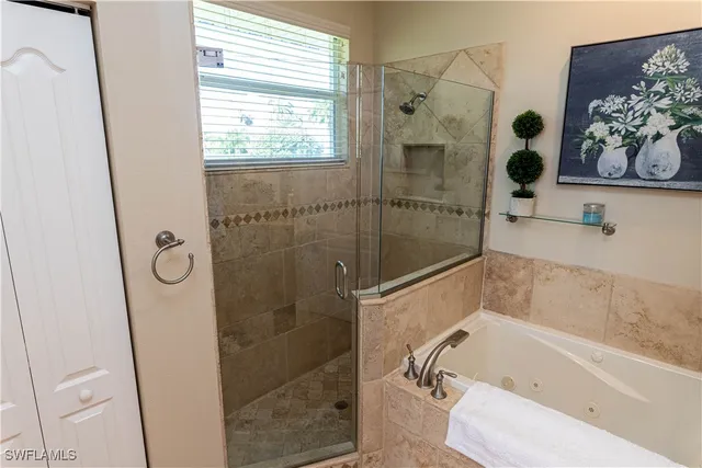 a bathroom with a bathtub and shower