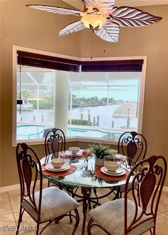a view of a dining room with furniture and window