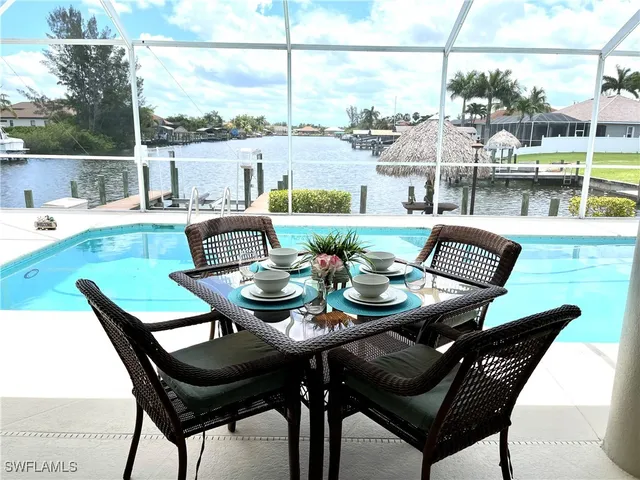 a view of a patio with furniture and outdoor view