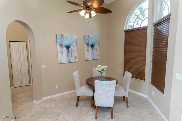 a dining room with furniture and window