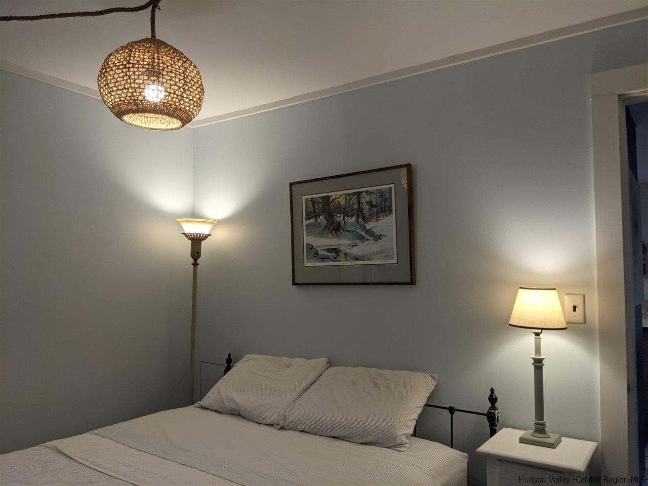 61 Birch Pine Hill Pine Hill, NY 12465 - Photo 7 of 11 a bedroom with a bed and a lamp