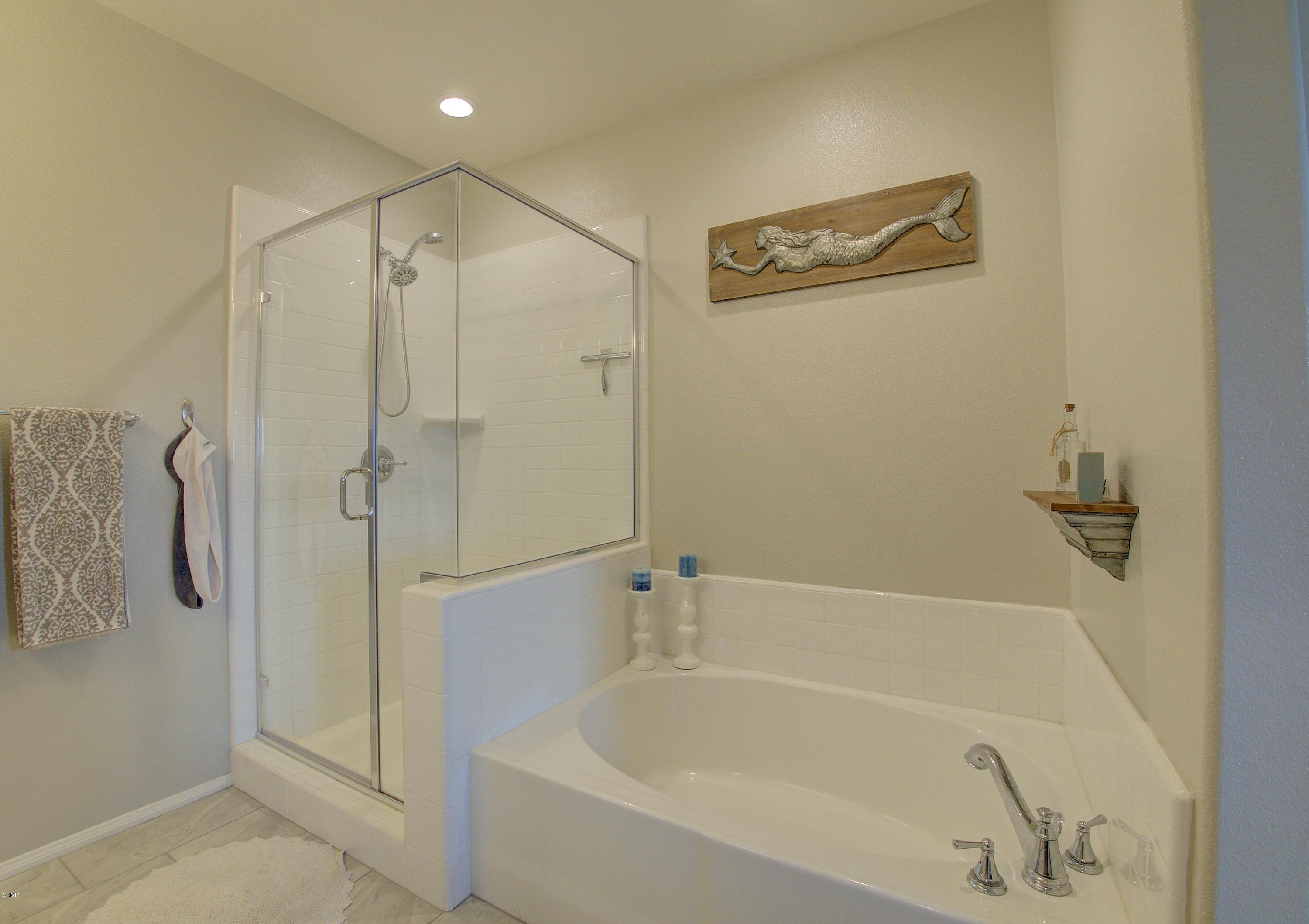 178 Prairie Street Camarillo, CA 93010 - Photo 27 of 74 a white bath tub sitting next to a shower