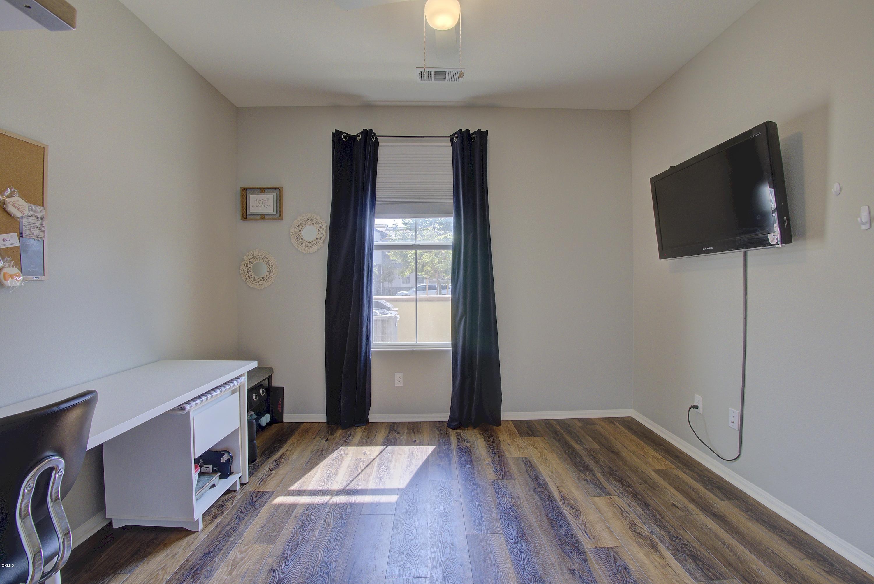 178 Prairie Street Camarillo, CA 93010 - Photo 39 of 74 a view of room with wooden floor and flat screen tv